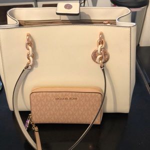 white and rose gold Michael Kors purse and wallet